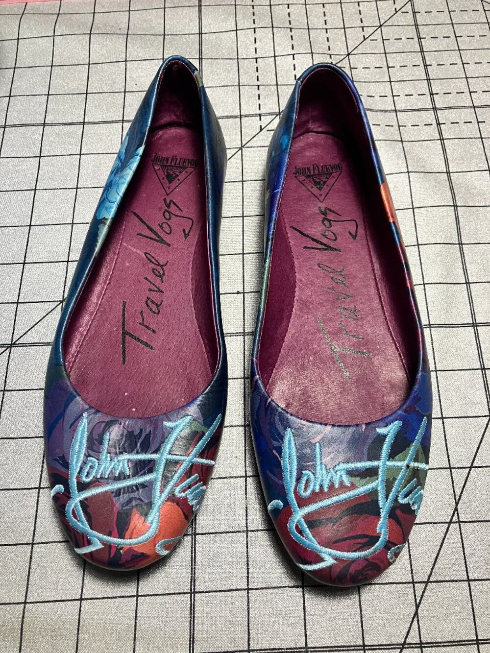 7.5 Travel Vog ballet flat in Maui; embroidered John Fluevog bright blue signatu
